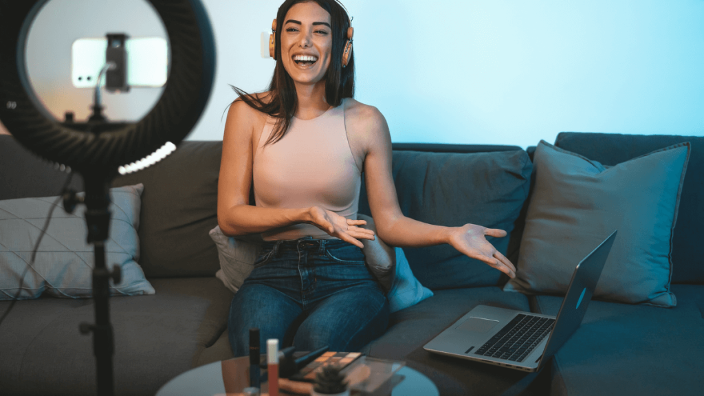 Happy student working online via livestream – unlocking the benefits of living alone as a student for career and personal growth.