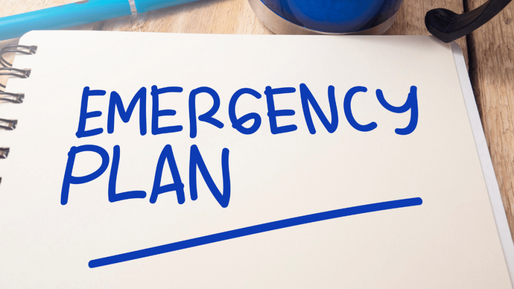 A notebook with the words "Emergency Plan", signifying coping with emergencies while living alone.